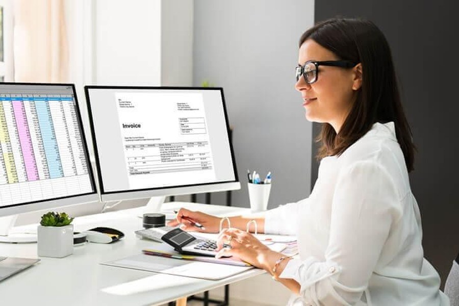 Finance professional reviewing invoices and receivables